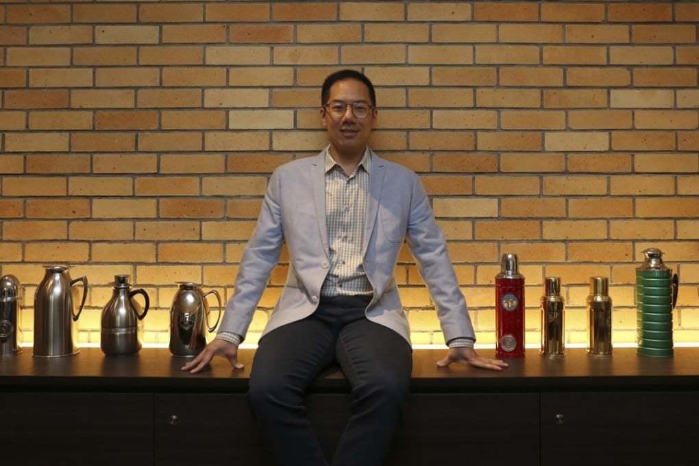 Raymond Leung with a display of Camel vacuum flasks at the Camlux Hotel, opened in the former flask factory. Photo: Jonathan Wong