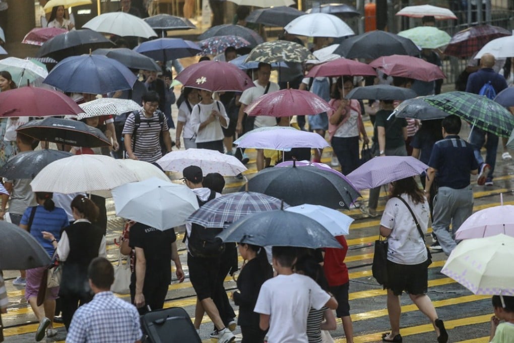 A sea of umbrellas in Causeway Bay on July 18. Relentless downpours on the day saw the Hong Kong Observatory issue three amber rainstorm signals in 15 hours. Photo: Sam Tsang