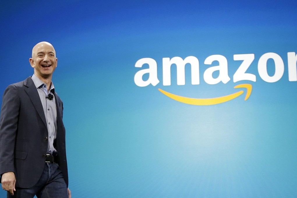 Amazon CEO Jeff Bezos walks onstage for the launch of the new Amazon Fire Phone, in Seattle. Photo: AP/Ted S. Warren