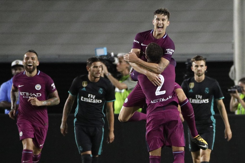Manchester City’s John Stones celebrates scoring a goal against Real Madrid in their Thursday friendly clash. Photo: AP