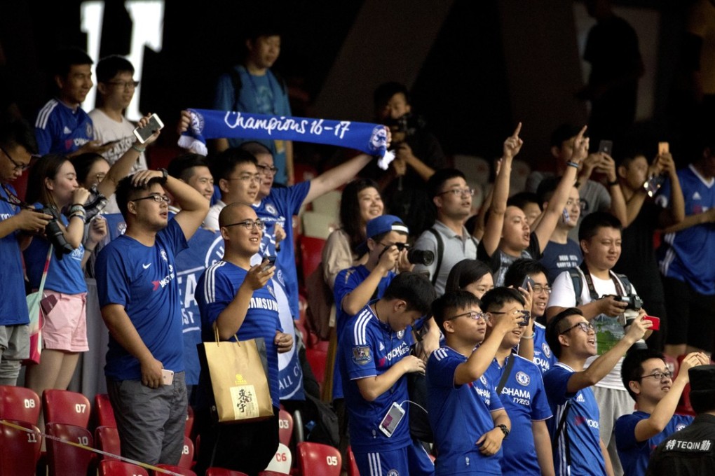 Chinese fans of Chelsea cheer during the team's practice session at the National Stadium. Photo: AP