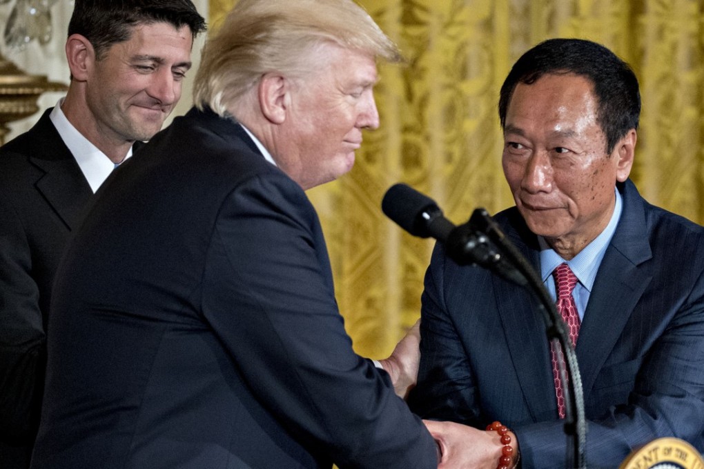 Terry Gou (right), chairman of Foxconn , shakes hands with US President Donald Trump,on Wednesday . Trump announced Foxconn plans a new factory in Wisconsin, fulfilling the Taiwan manufacturing giant’s promise to invest in the US Photo: Bloomberg