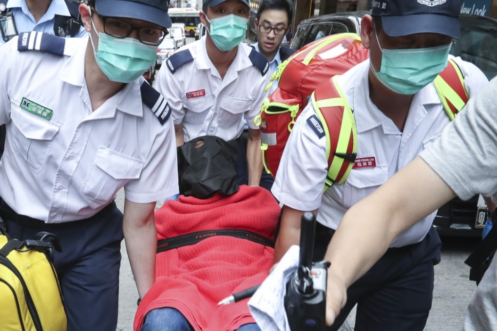 The suspect is taken to the hospital. Photo: Nora Tam