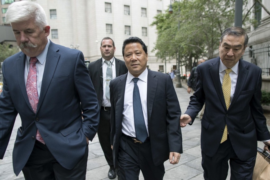 Ng Lap-seng, centre, leaves a federal court in Manhattan on Thursday after being convicted of briber, money laundering and conspiracy. Photo: AP