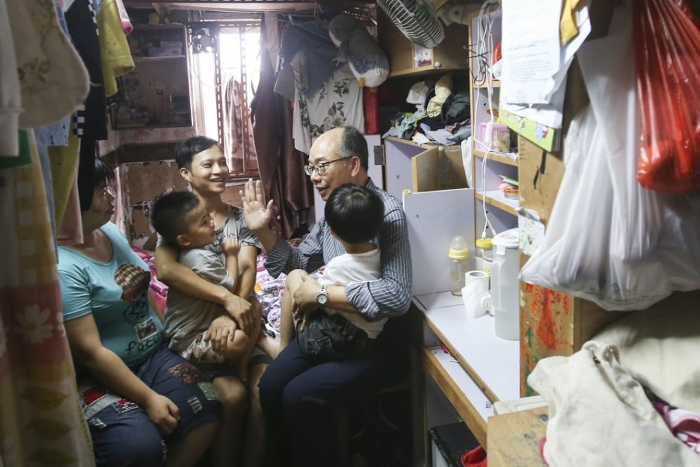 Secretary for Transport and Housing Frank Chan Fan visits a cramped home in Sham Shui Po. Photo: David Wong