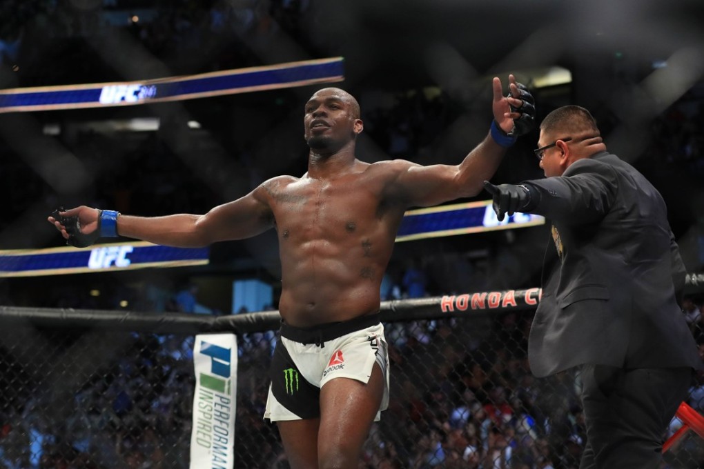 Jon Jones celebrates after knocking out Daniel Cormier in their UFC light heavyweight championship bout. Photo: AFP