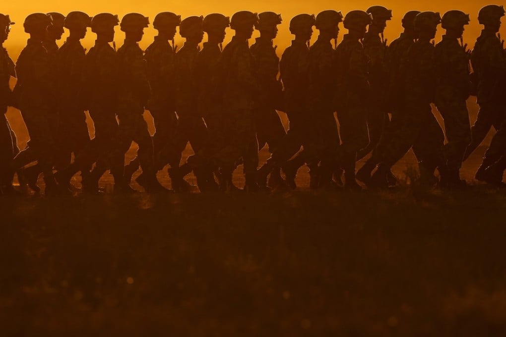 PLA troops march in formation on Sunday as they arrive for a military parade at the Zhurihe training base in Inner Mongolia. Photo: Xinhua