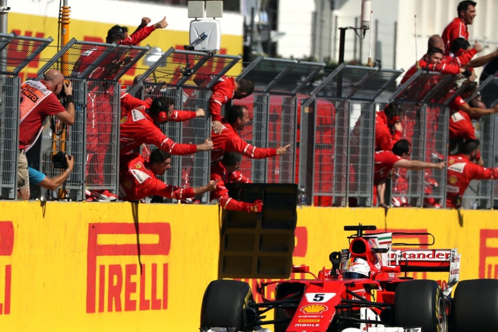 Ferrari's German driver Sebastian Vettel drives over finish line to win the Hungarian Grand Prix at the Hungaroring racing circuit in Budapest. Photo: AFP