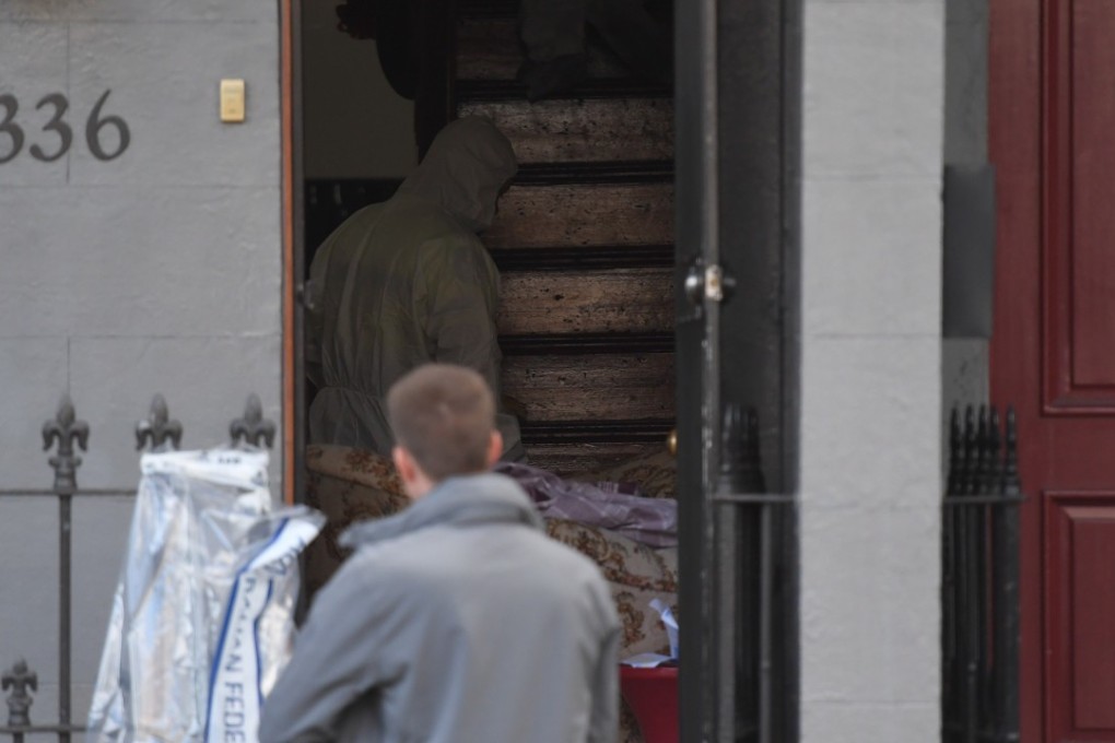 Police establish a crime scene at a property in Surry Hills, Sydney. Photo: EPA