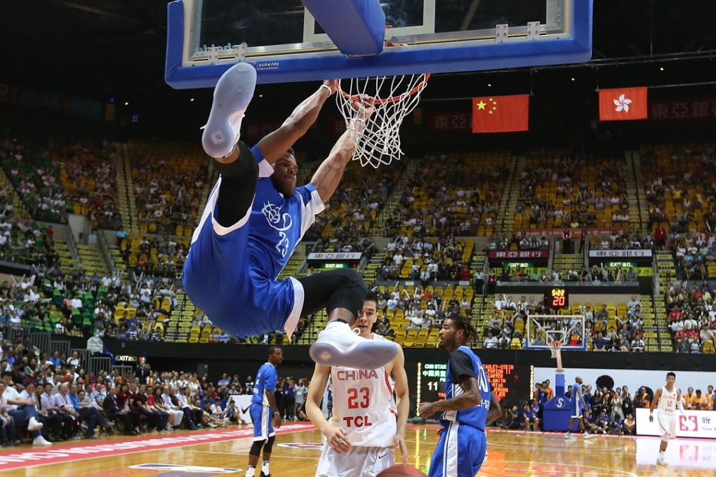 Justin Anderson of the Philadelphia 76ers slam dunks during Sunday night’s NBA v CBA players exhibition at the Yao Foundation charity basketball game at Hong Kong Coliseum in Hung Hom. Photos: Dickson Lee