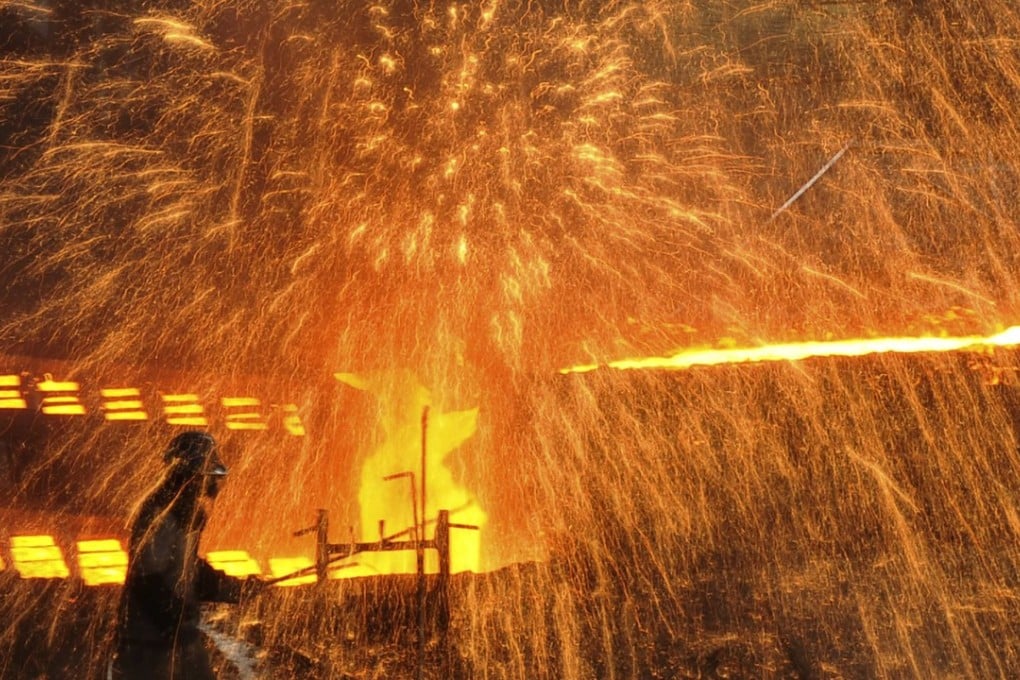 A steel worker at a plant in Dalian, Liaoning. The industrial province has struggled to keep pace with the rest of the Chinese economy. Photo: Reuters/ China Daily