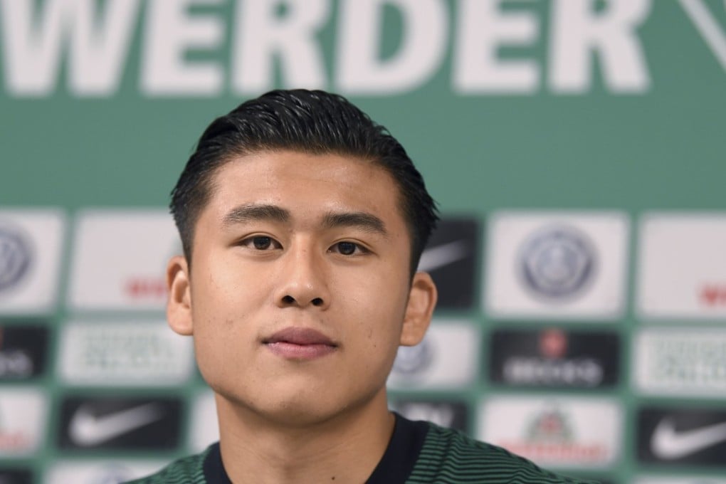 Werder Bremen’s new signing Zhang Yuning smiles at a press conference. He has moved to Germany on loan from West Brom, who he signed for following two years playing ion Netherlands. Photo: AP
