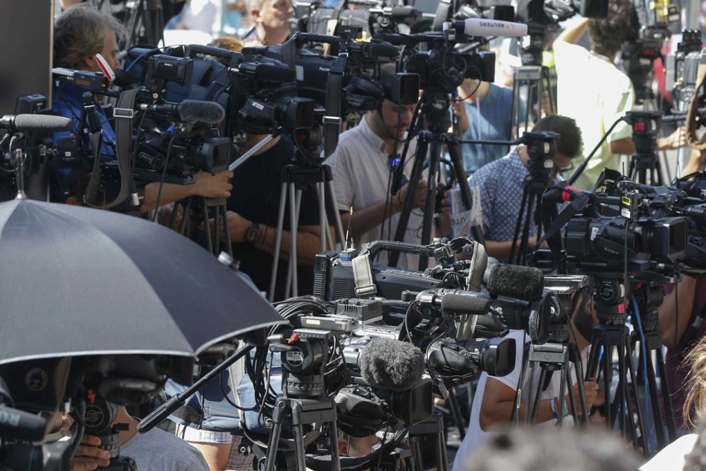 Dozens of cameras belonging to the media are trained on the Madrid courthouse to catch Cristiano Ronaldo, who managed to avoid journalists. Photo: EPA