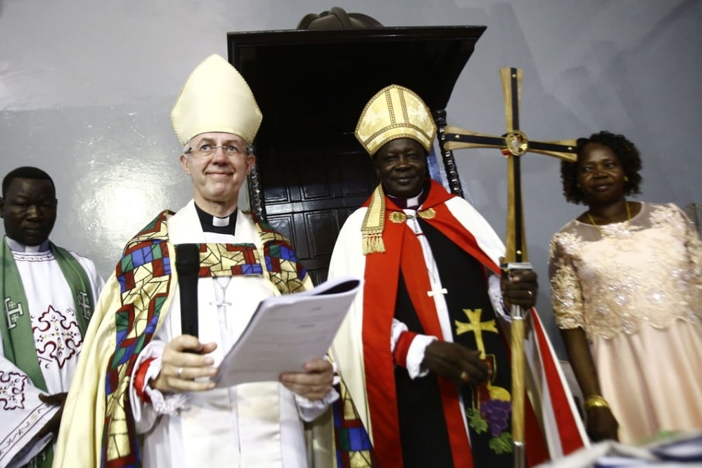 Archbishop of Canterbury, Justin Welby (second left), and Ezekiel Kondo Kumir Kuku (second right), Sudan's newly appointed first archbishop, attend a ceremony in Khartoum's All Saints Cathedral on Sunday. Photo: AFP