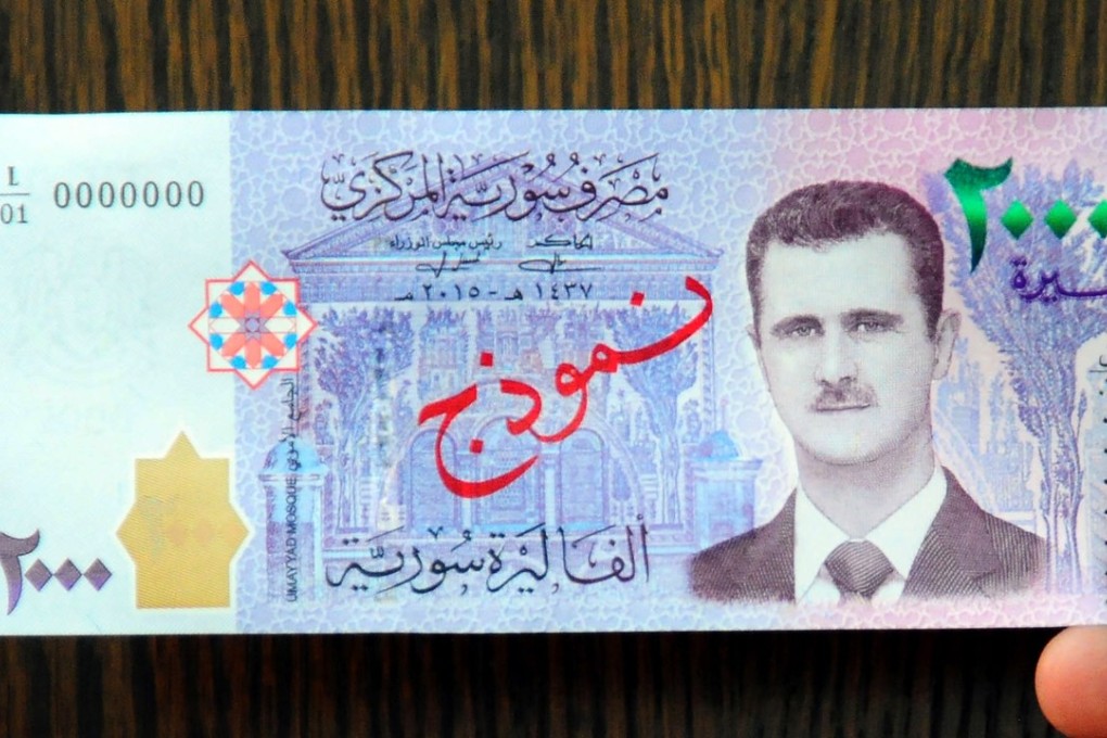 A handout picture released by the official Syrian Arab News Agency last month shows Syria's newly announced 2,000-pound note, featuring the face of President Bashar al-Assad for the first time. Photo: AFP