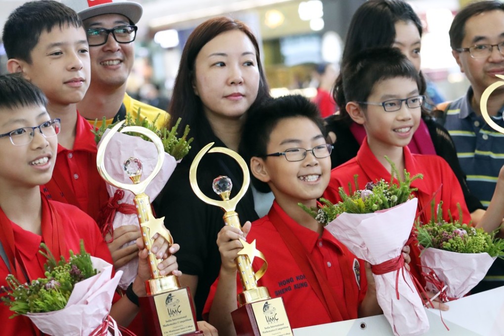 Winning team members Wong Ping-kuen, Rex Lo Chung-hei, Yiu Chun-hei and Chu Cheuk-hei (from left in red) display their trophies. Photo: Nora Tam