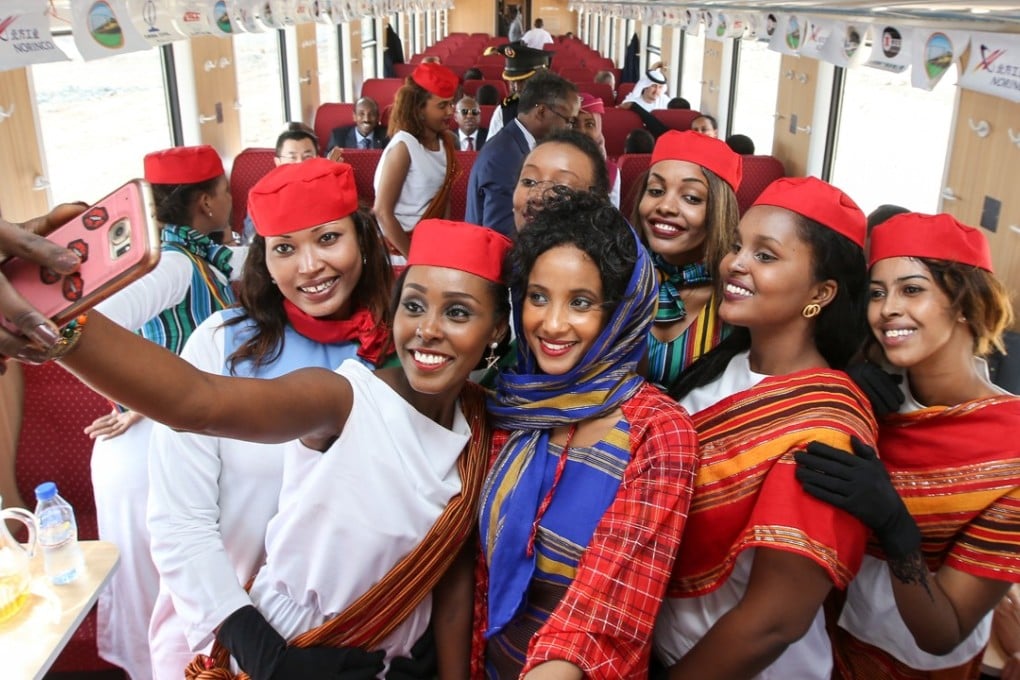 Passengers and crew take a selfie on the first departure of the Djibouti-Addis Ababa railway in January this year. Chinese smartphone maker Transsion has a 40 per cent share of the market in sub-Saharan African countries. Photo: Felix Wong
