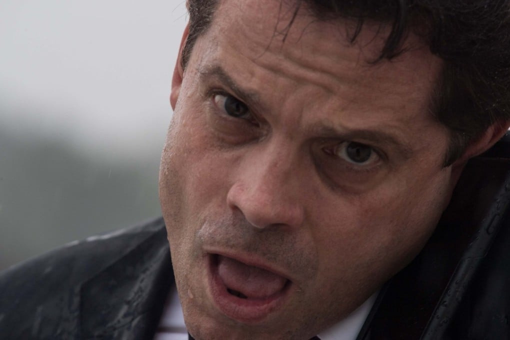 Anthony Scaramucci speaks on the phone as he boards Air Force One. Photo: AFP
