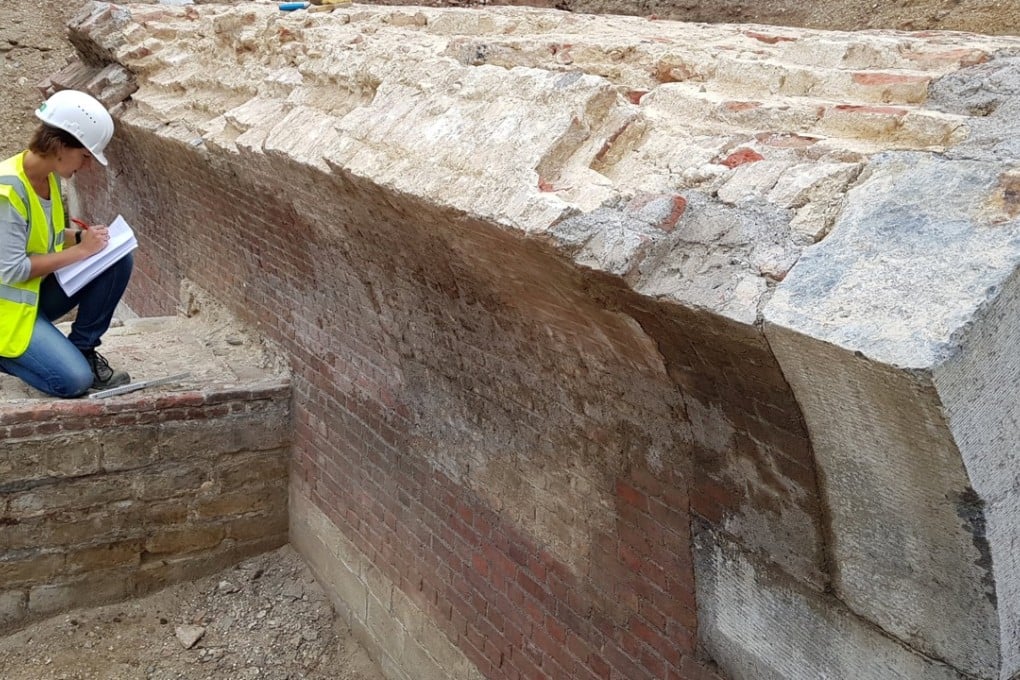 Belgian archaeologist Femke Martens inspects a 16th century fortification unearthed after tram works in Antwerp, Belgium on August 1, 2017. Photo: Reuters