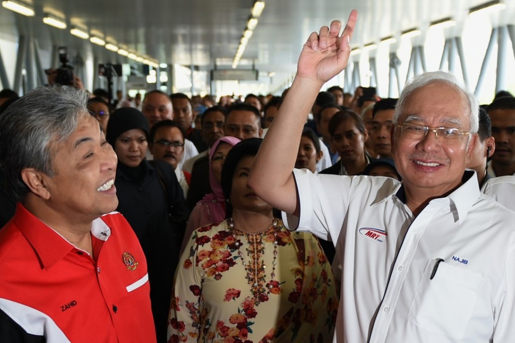 Malaysian Prime Minister Najib Razak, right, and Deputy Prime Minister Ahmad Zahid Hamidi arrive at Kajang station to launch the Sungai Buloh-Kajang MRT line in Kuala Lumpur. Photo: AFP