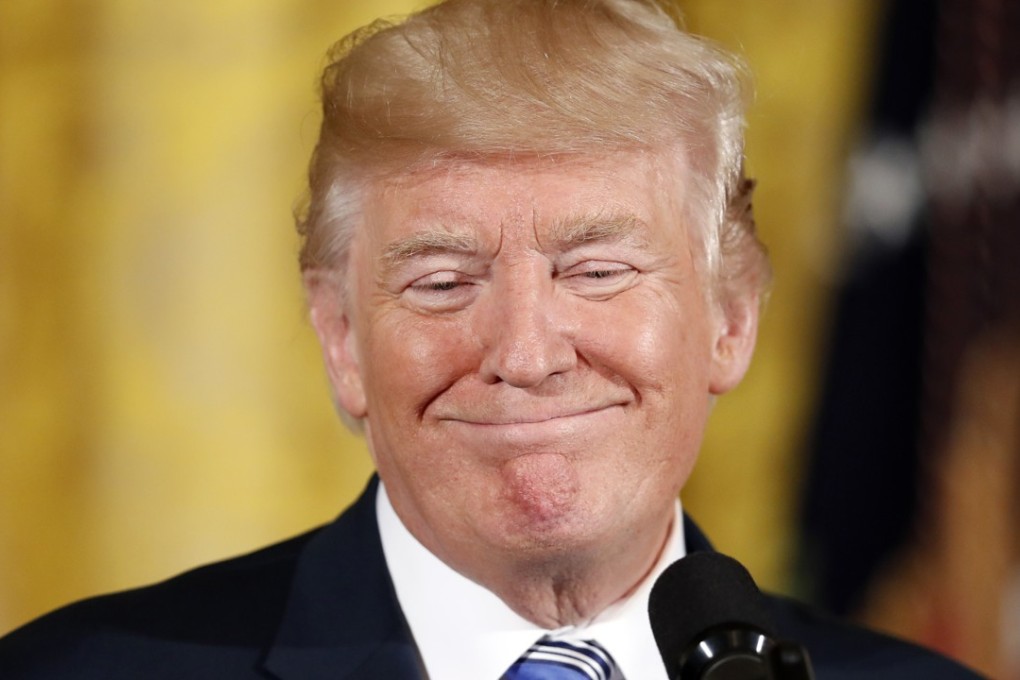 President Donald Trump smiles in the East Room of the White House. The US leader refused to drop his twitter habit. Photo: AP