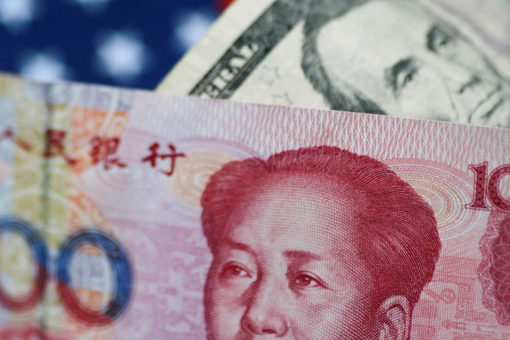 The US Dollar and China Yuan notes are seen in this picture illustration. The greenback dropped to its lowest level in 15 months on Tuesday, August 1, 2017. Photo: Reuters