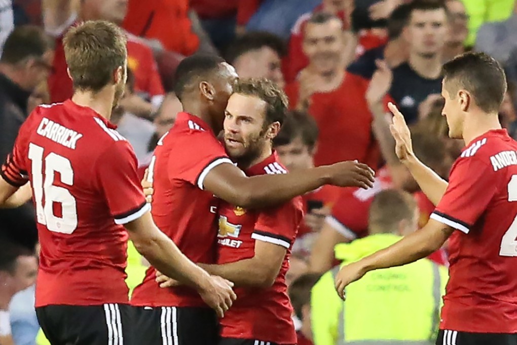 Manchester United midfielder Juan Mata celebrates with teammates after scoring the winning goal during the pre-season friendly against Sampdoria in Dublin. Photo: AFP
