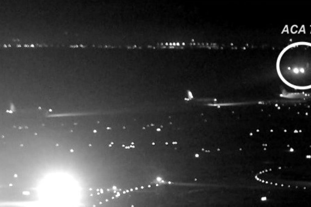 This image released by the National Transportation Safety Board (NTSB) shows Air Canada flight 759 (ACA 759) attempting to land at the San Francisco International Airport on July 7, bottom. The plane almost landed on four other airliners waiting on a taxiway. Photo: NTSB via AP