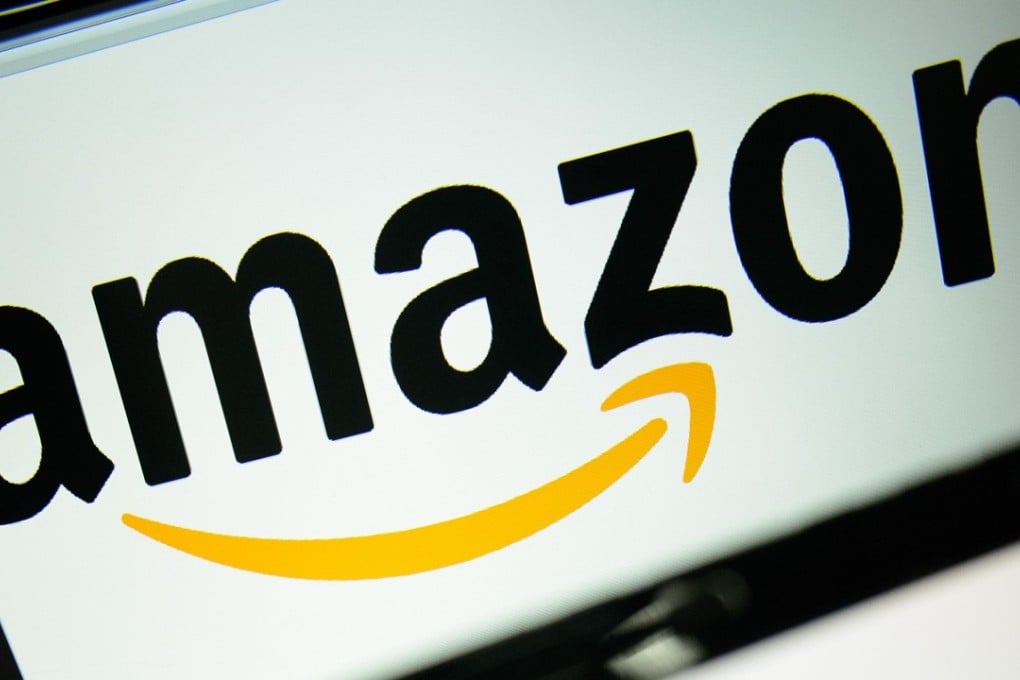 The logo of the online retailer Amazon displayed on computer screens in London. Photo: AFP/LEON NEAL