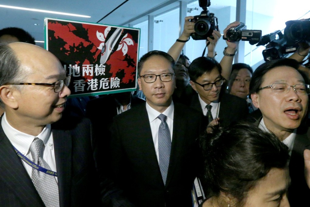 Secretary for Transport and Housing Frank Chan Fan (left), Secretary for Justice Rimsky Yuen and Secretary for Security John Lee at the Legislative Council on Thursday. Photo: Dickson Lee