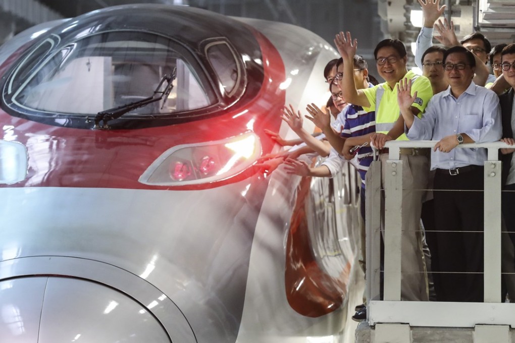 MTR Corp chair Frederick Ma Si-hang (in yellow) shows Hong Kong lawmakers around the West Kowloon Terminus of the Guangzhou-Shenzhen-Hong Kong express rail link, on August 2. The pan-democratic bloc boycotted the tour. Photo: Edward Wong