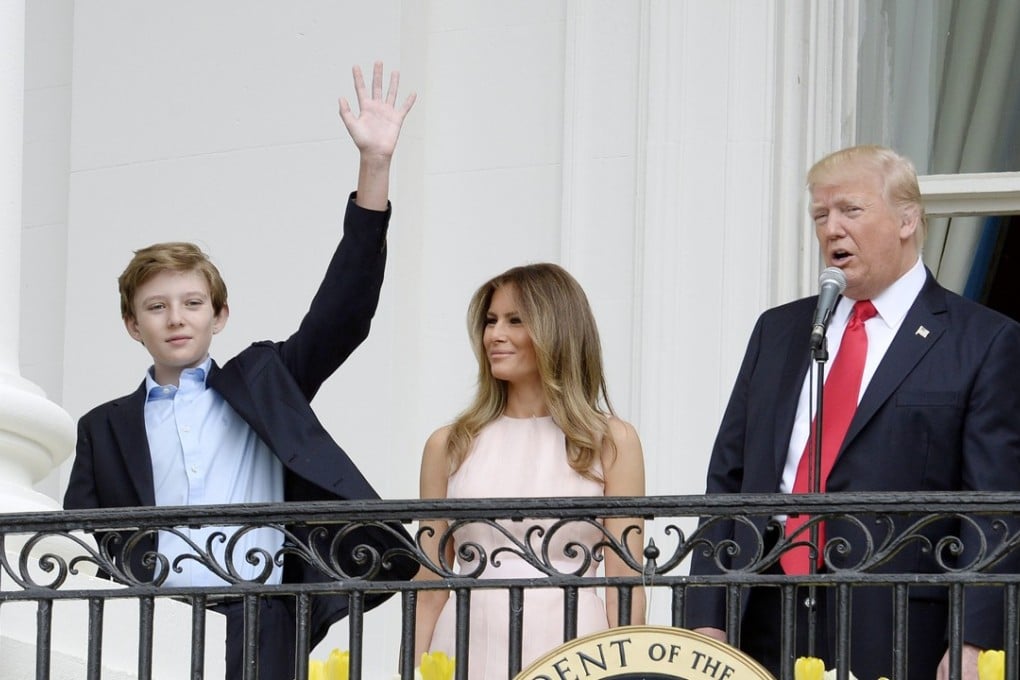 US President Donald Trump , first lady Melania Trump and son Barron Trump attend the annual Easter Egg Roll at the South Lawn of the White House. Trump has disputed a report he called the White House a ‘dump’. File photo: EPA