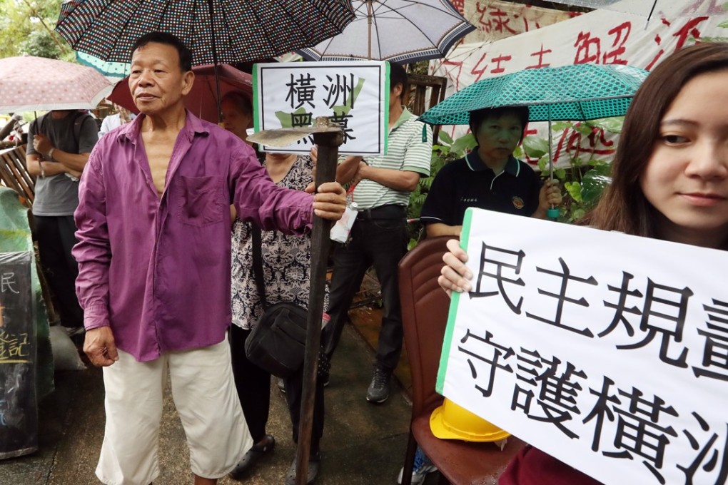 Wang Chau villagers protest outside the Yuen Long Government Offices. Photo: Edward Wong