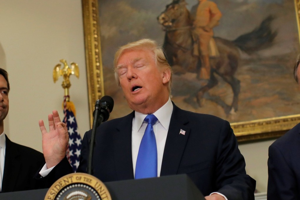 US President Donald Trump speaks during an announcement on immigration reform accompanied by Senator Tom Cotton and Senator David Perdue, in the Roosevelt Room of the White House in Washington. Photo: Reuters