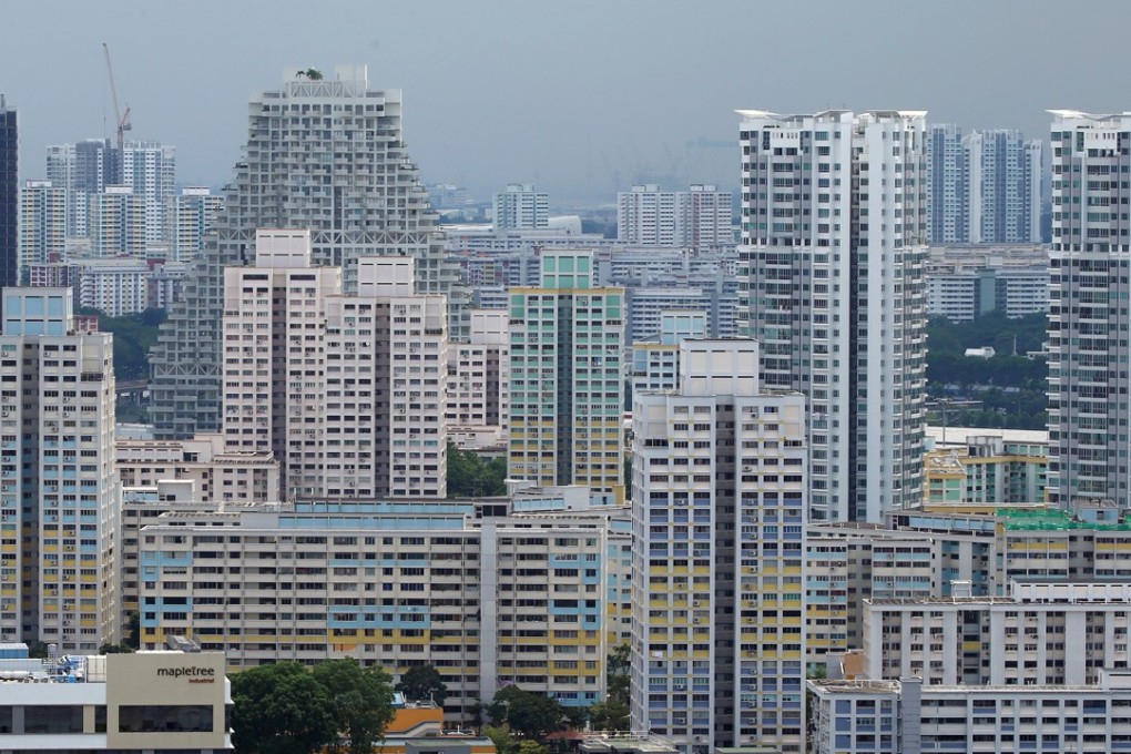 Private residential apartments and public housing estates in Singapore. Increasingly, Chinese firms are outbidding local firms for new property projects in the Lion City. Photo: Reuters