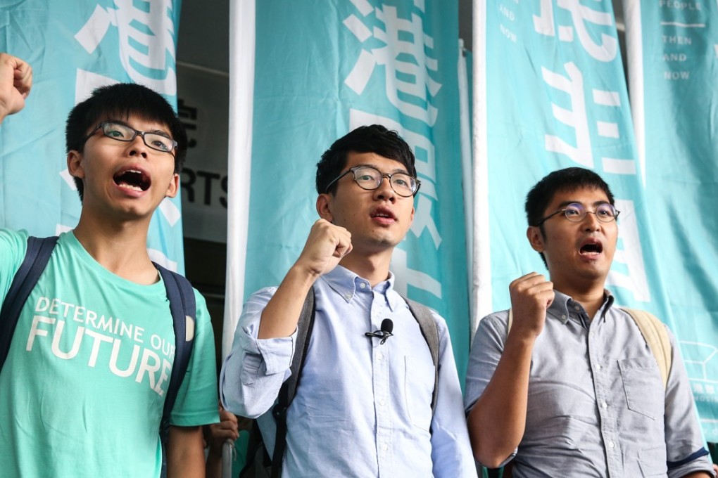 (Left to right) Joshua Wong Chi-fung, Nathan Law Kwun-chung and Alex Chow Yong-kang outside Eastern Court in Sai Wan Ho. Photo: Sam Tsang