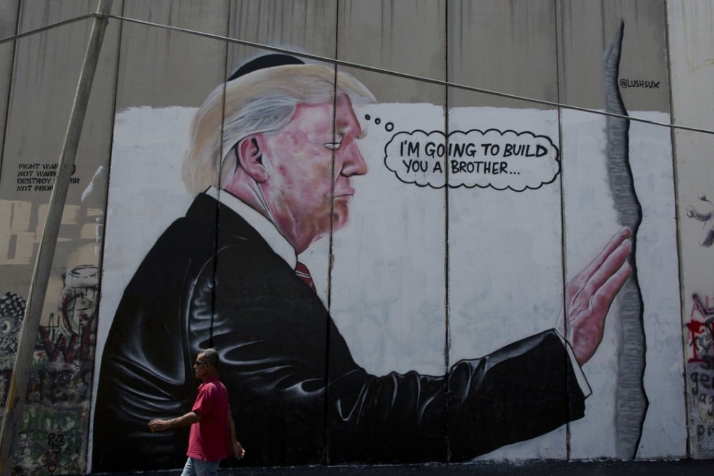 A mural depicts US President Donald Trump wearing a Jewish skullcap. Photo: AP