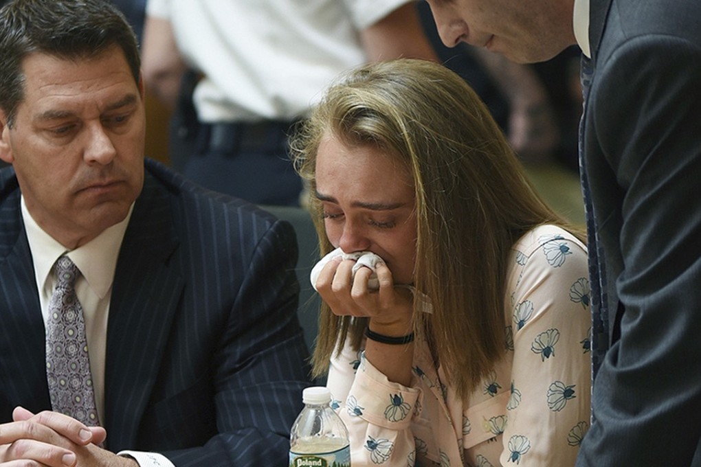 Michelle Carter cries while flanked by defence attorneys Joseph Cataldo, left, and Cory Madera, after being found guilty of involuntary manslaughter in the suicide of Conrad Roy III in Bristol Juvenile Court in Taunton, Massachusetts. She was sentenced to 15 months in jail on Thursday, August 3, 2017. Photo: Fairhaven Neighbourhood News