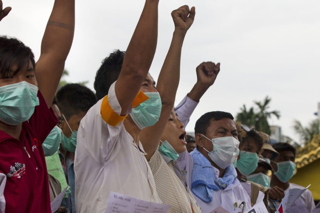 Buddhist nationalists shout slogans during a protest at their camp at entrance of a pagoda in Yangon, Myanmar. Photo: AP