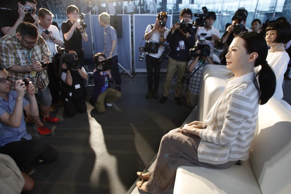 Robot newscasters Kodomoroid and Otonaroid meet the Japanese press in Tokyo. Photo: AP