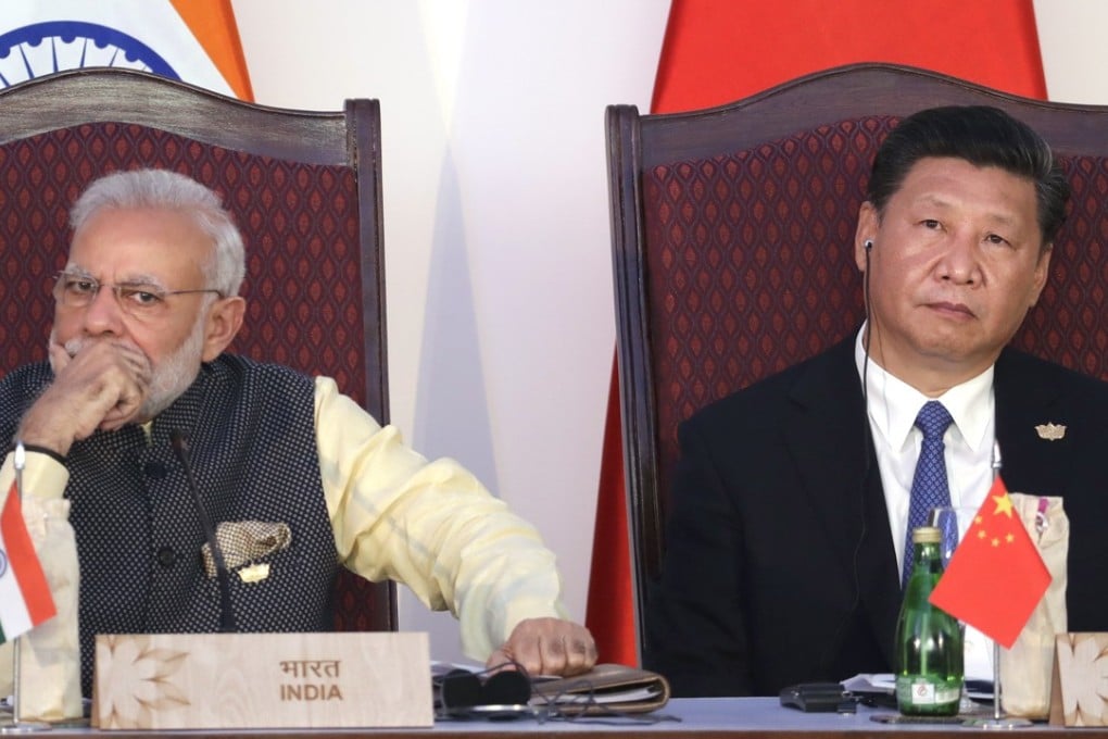 Indian Prime Minister Narendra Modi (left) and Chinese President Xi Jinping listening to a speech during a BRICS meeting in India last year. Photo: AP