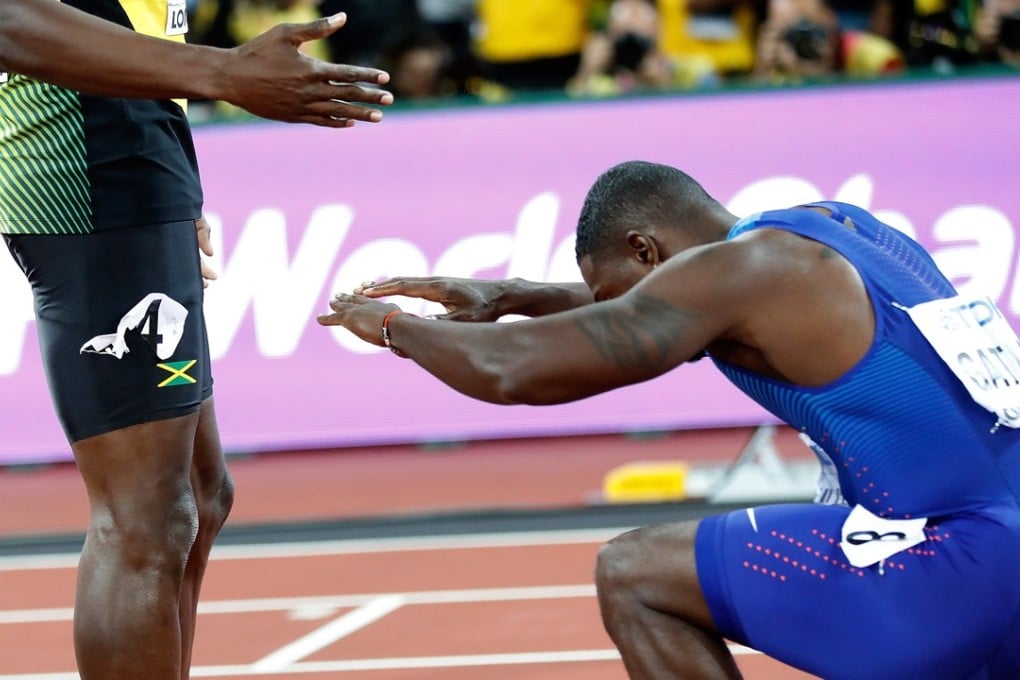 Justin Gatlin of the United States greets Jamaican Usain Bolt after 100 metres final at the IAAF World Championships in London. Photo: Xinhua
