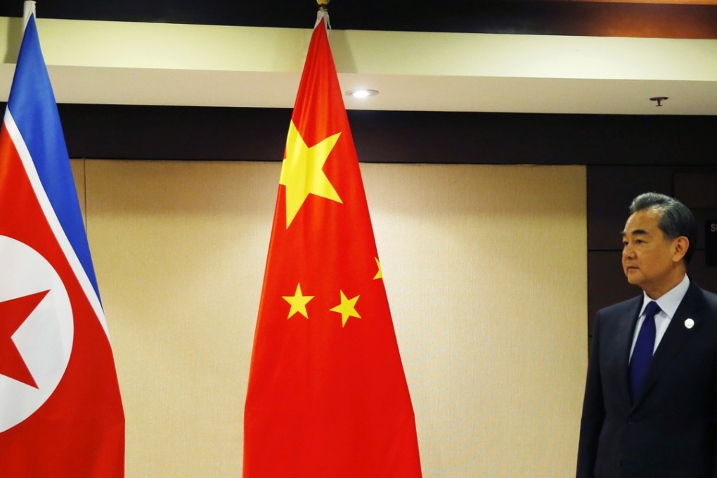 Chinese Foreign Minister Wang Yi waits for the arrival of North Korean Foreign Minister Ri Yong Ho for their bilateral meeting in the sidelines of the Asean Foreign Ministers' Meeting and its Dialogue Partners. Photo: AP
