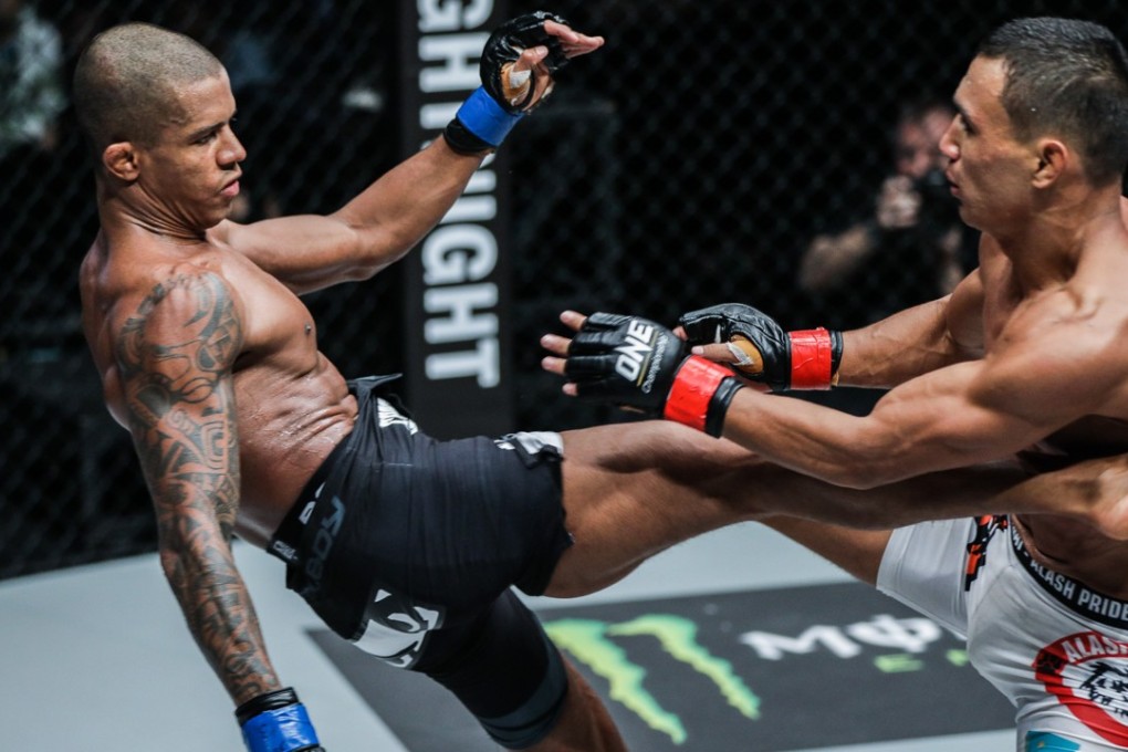 Adriano Moraes lands a kick on Kairat Akhmetov during their flyweight bout on Saturday night. Photos: One Championship