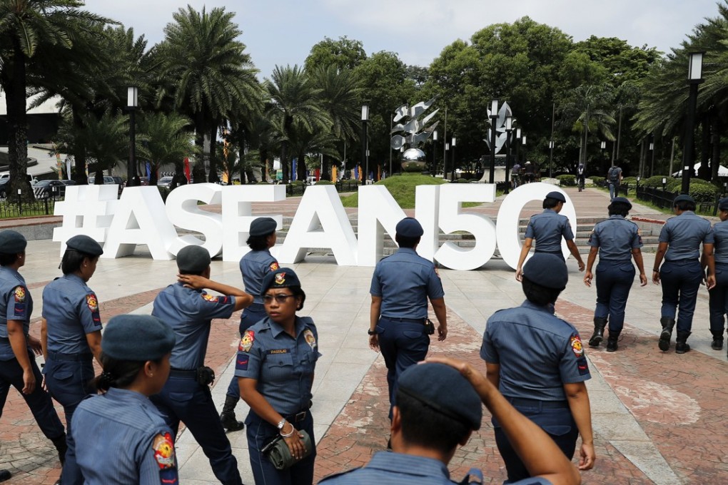 Filipino police officers patrol the vicinity of the venue of the Asean Foreign Ministers’ Meeting in Manila, on August 6. Asean, which turns 50 this year, rarely celebrates itself, and critics have long predicted its imminent demise, but there are good reasons to consider its model. Photo: EPA
