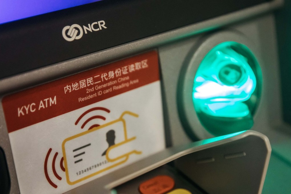 Macau teller machines are now equipped with enhanced KYC (Know Your Customer) compliance capabilities that require identity cards and faces to be scanned before cash withdrawals can be made. Photo: Bloomberg