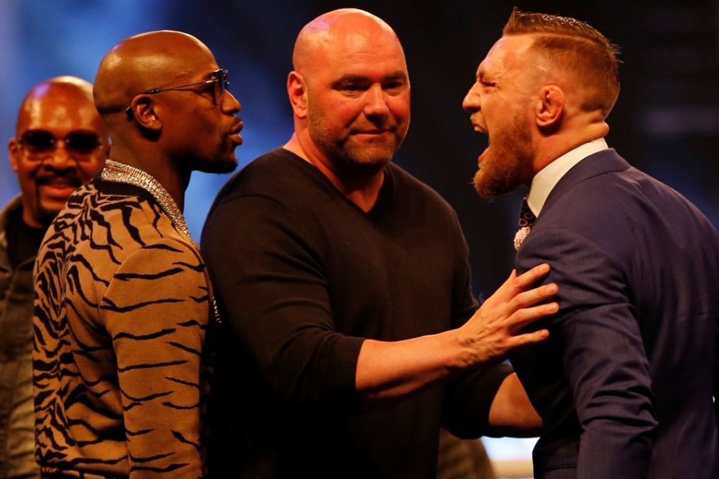 UFC president Dana White separates Floyd Mayweather and Conor McGregor. Photo: Reuters