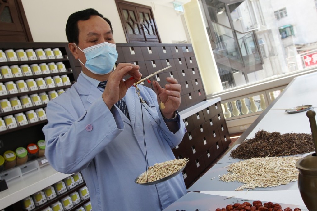 Preparing medicine at a Chinese clinic in Mong Kok. Photo: David Wong