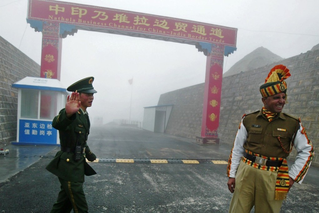 A Chinese soldier next to an Indian soldier at the Nathu La border crossing in Sikkim in 2008. Photo: AFP