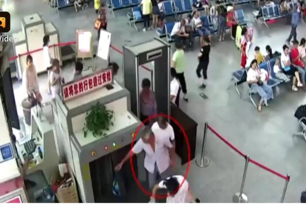 The man pictured going through the security scanner in Guizhou province. Photo: Handout